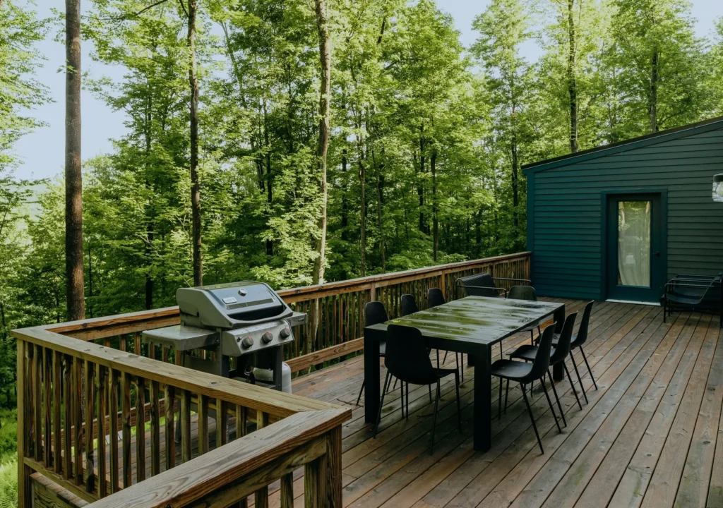 Spacious deck surrounded by lush trees